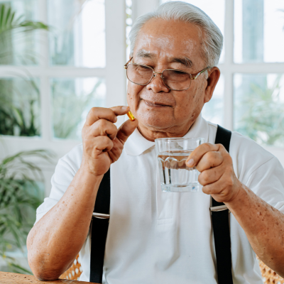 Senior taking medicine